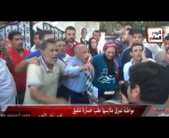 مصرية تمزّق ملابسها احتجاجاً على فوز مرسي !