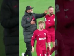 Jurgen Klopp and Jordan Henderson greet the kop after a Liverpool win
