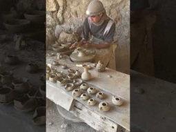 Potter&#39;s Wheel - Kid making pottery in the old style
